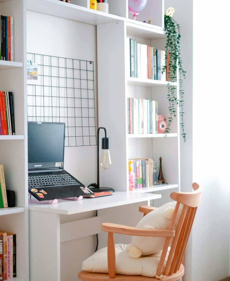 Small reading nook with desk, accent chair, lamp, and warm minimalist décor