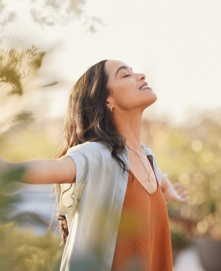 brunette women spreading her arms out living a fulfilling life