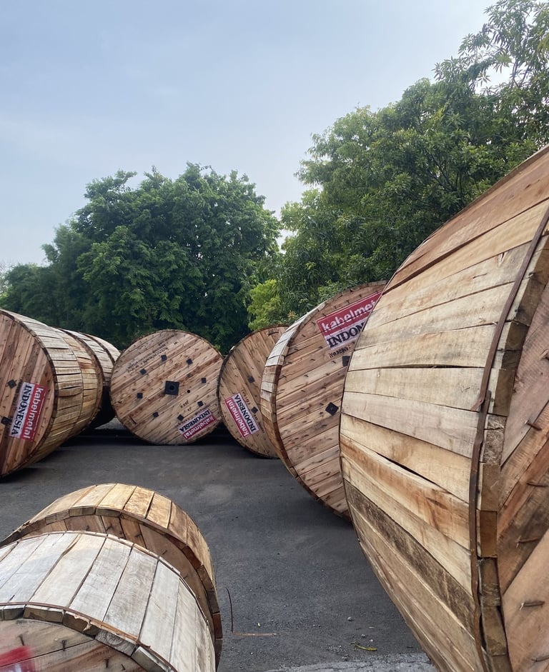 a bunch of wooden barrels stacked on top of each other kabel metal untuk listrik