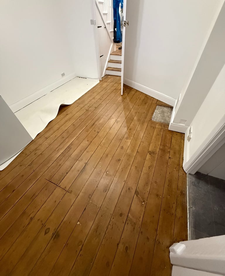 Restored wooden hallway floor in Worthing Sussex, sanded and sealed timber boards