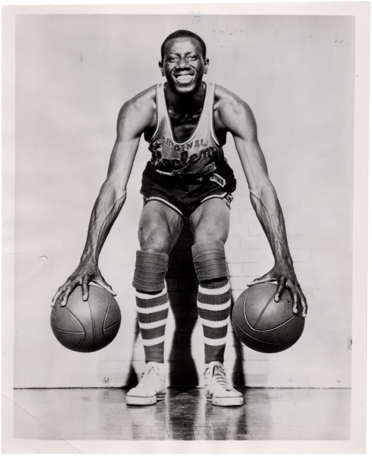 April 18th, 1956 Goose Tatum Team Issue Type 1 photograph holding a basketball in each hand