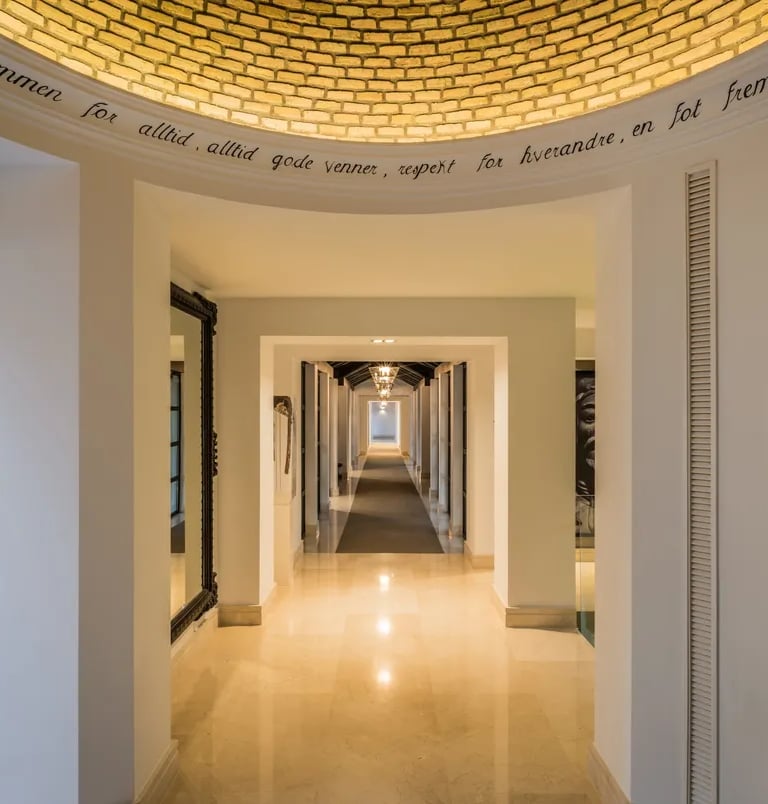 Golden-domed hallway with marble floors and symmetrical arches at Villa El Olivo, Marbella