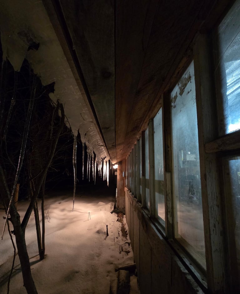 ice and snow outside a dark window