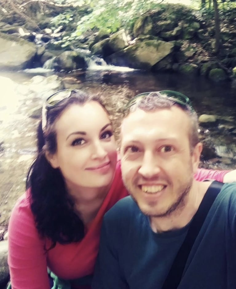A photo of smiling man and woman