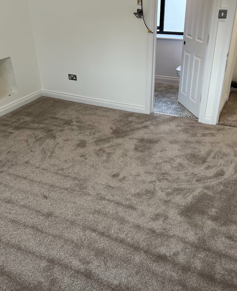 Carpeted bedroom flooring installation in Brighton Sussex, professional interior finish