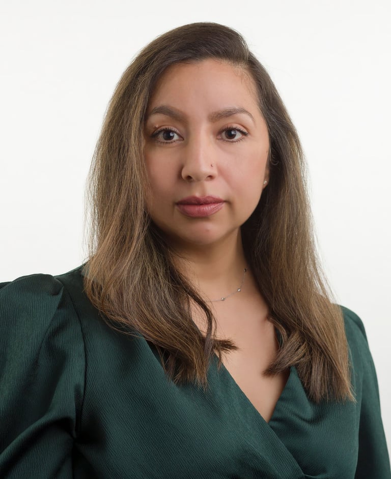 a woman with a green blouse and a white background