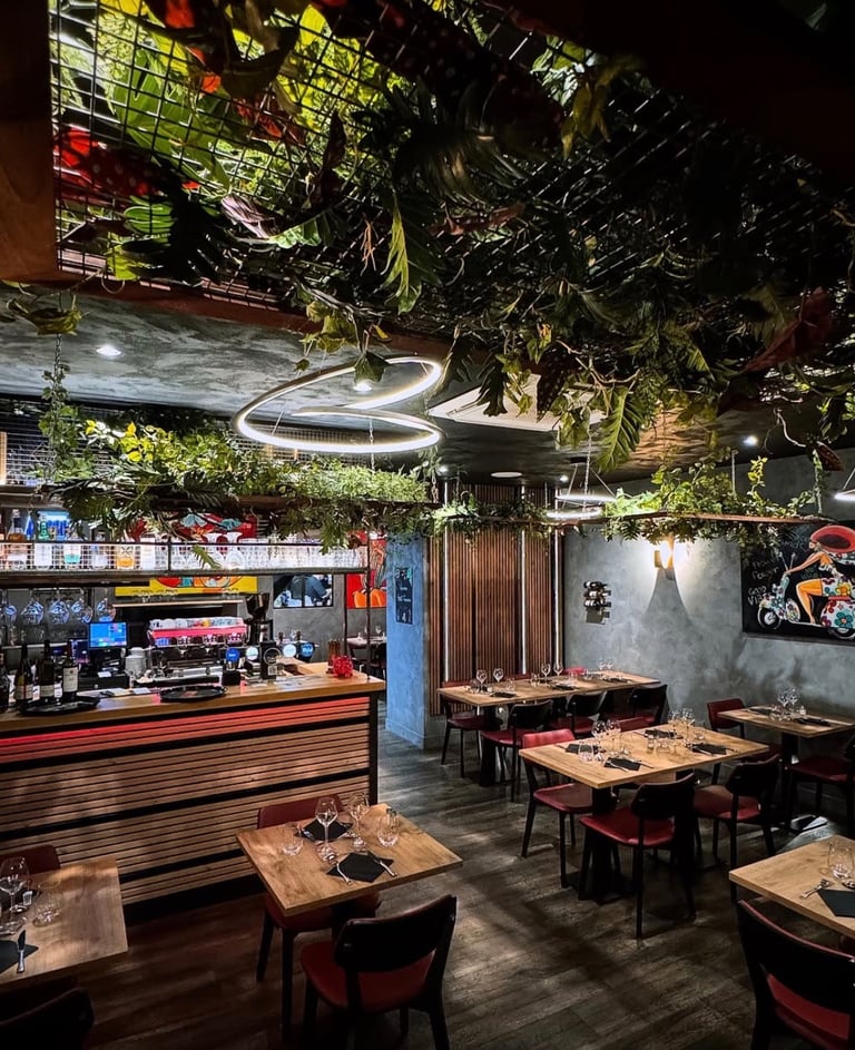 a restaurant with a large amount of plants and a bar