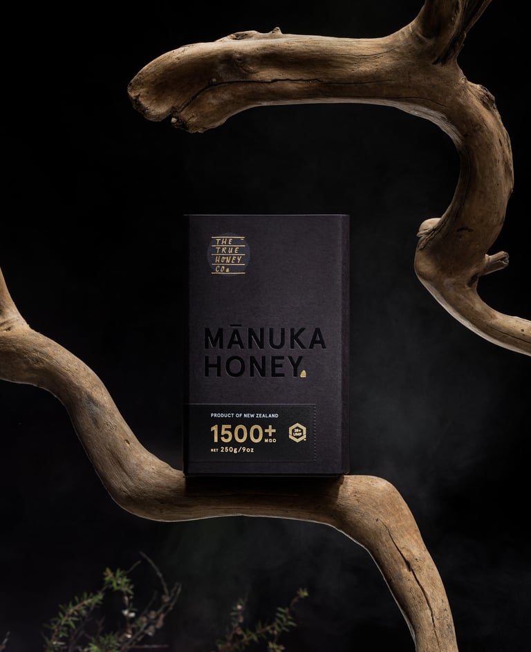 Product photography - box of honey balanced on a branch