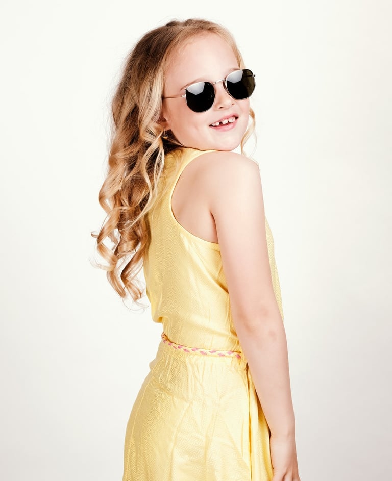 portrait of a young girl wearing sunglasses and sunglasses