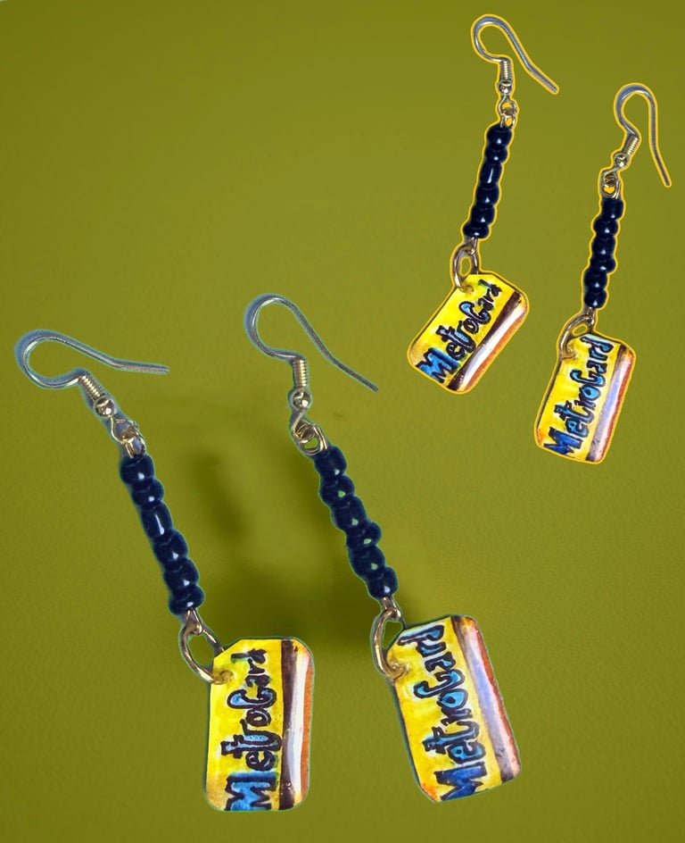 dangle earrings with hand drawn charms of Metrocards with black beads