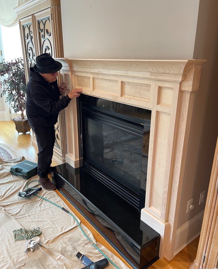Gregory Christeas staining a custom wood fireplace mantel in a Monmouth County NJ home