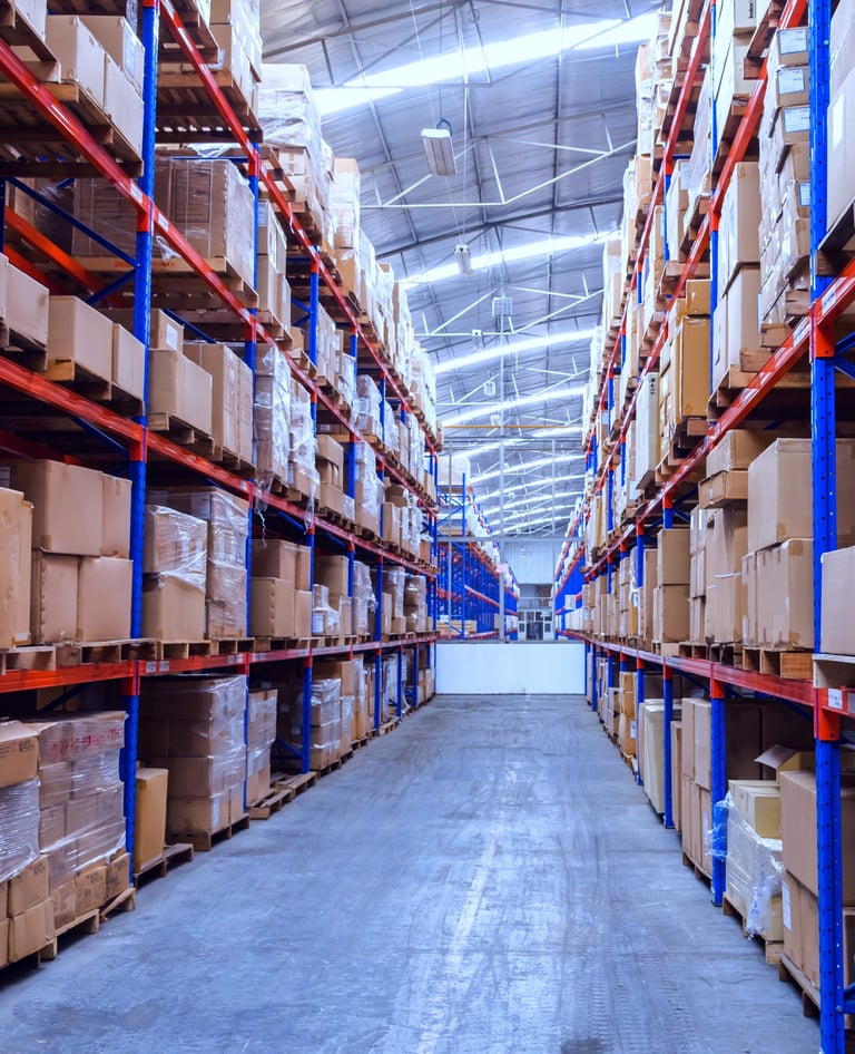 Narrow Aisle Pallet racking in warehouse storing boxes of goods