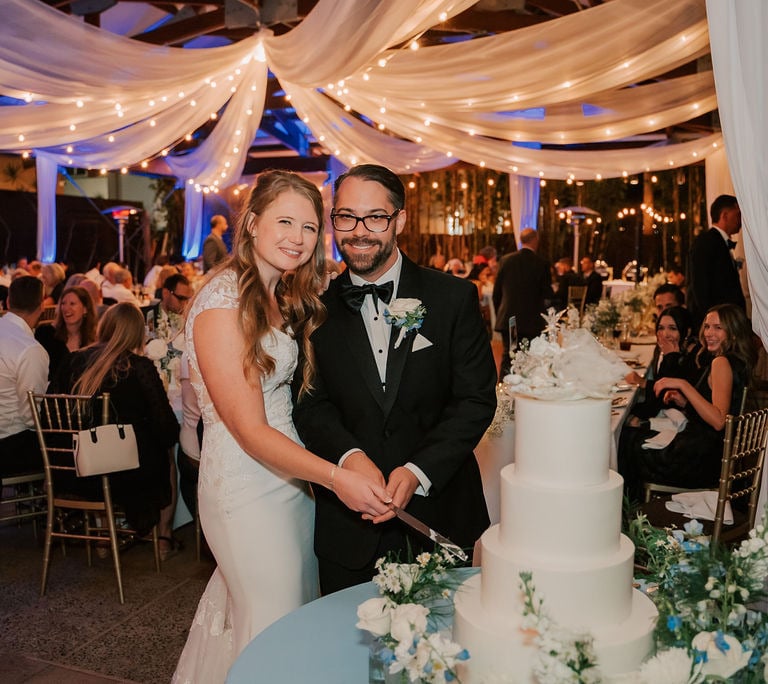 Bride and groom cutting cake at Bali Hai Restaurant wedding 