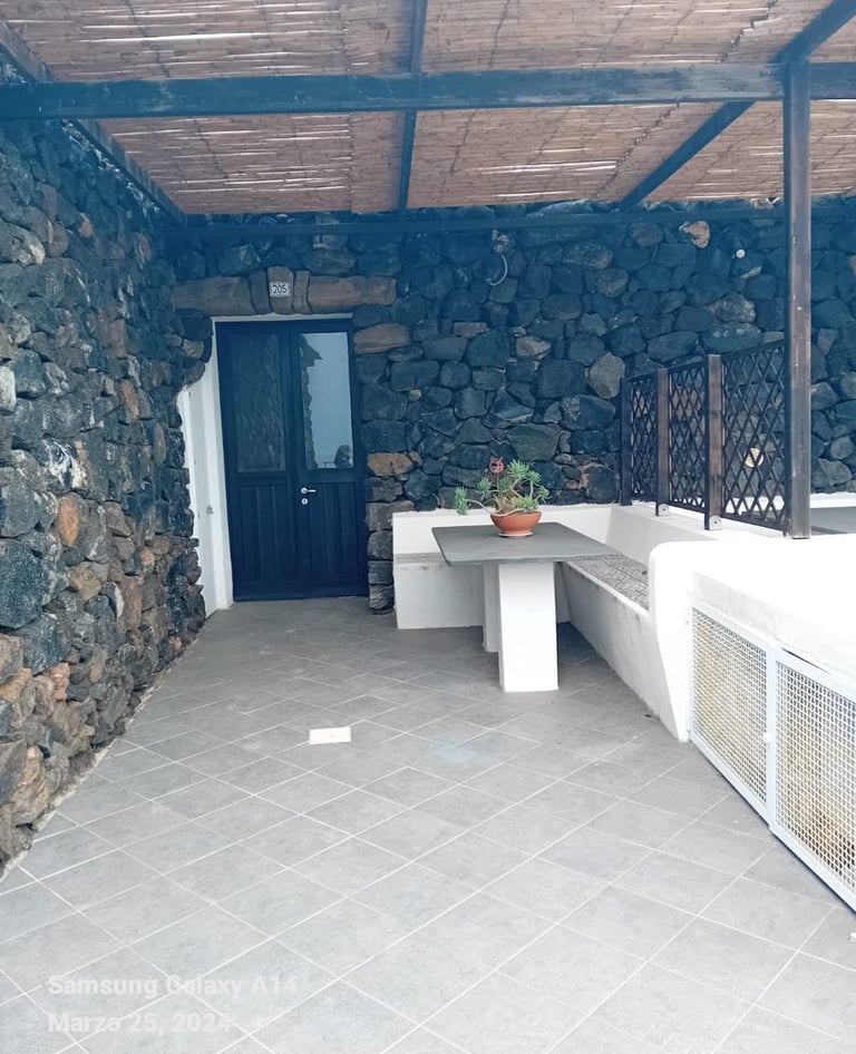 Dammuso in Sataria with stone walls near the Sataria caves