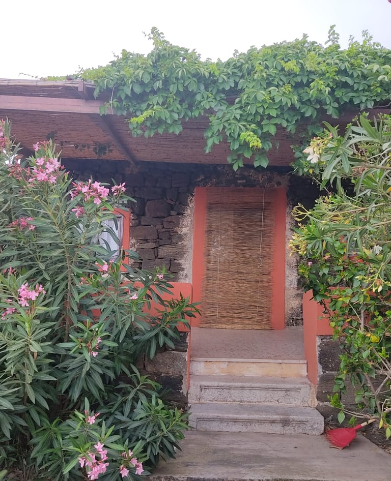 Dammuso in Khattibuale with stone entrance near Lake Specchio di Venere