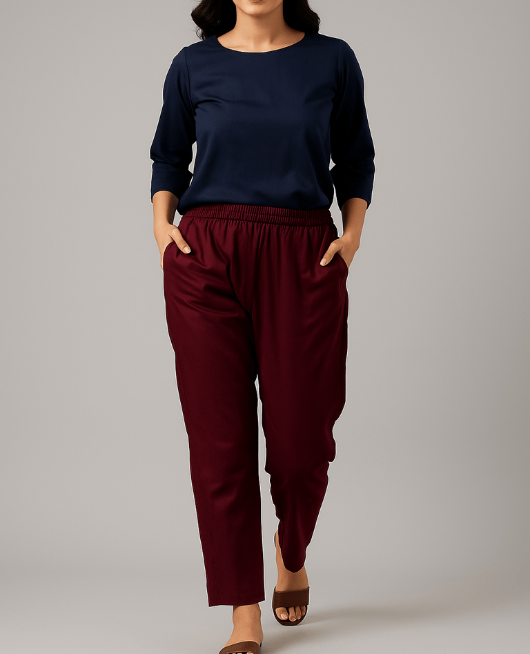 a woman in a blue top and pants with a black top