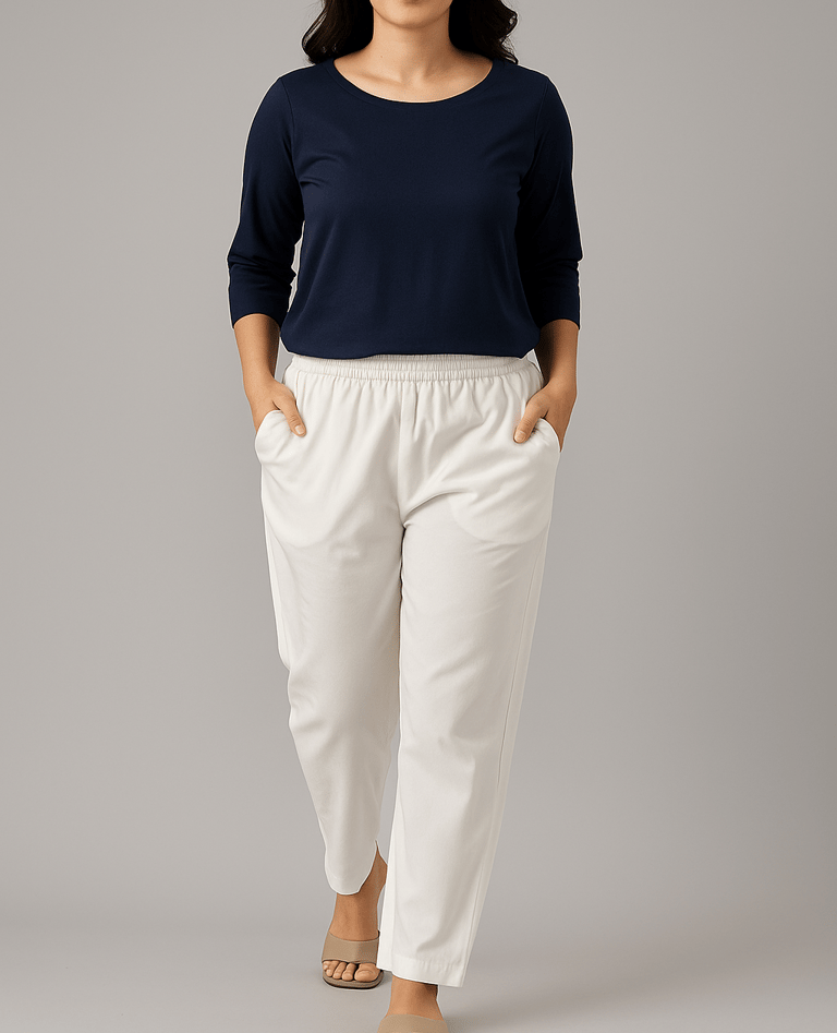 a woman in a blue top and white pants