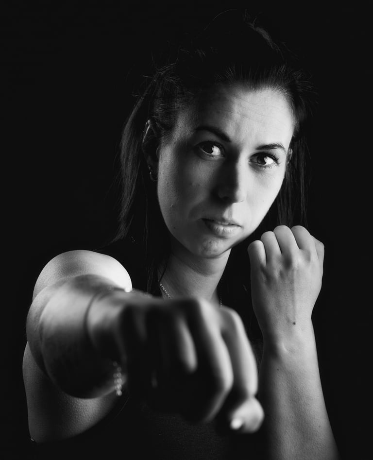 portrait of a woman with a fist