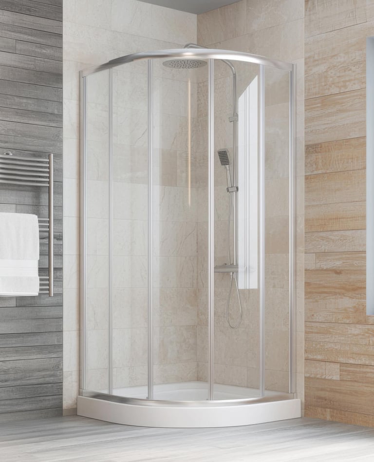 Modern bathroom with curved glass shower enclosure and chrome shower head in Auckland home