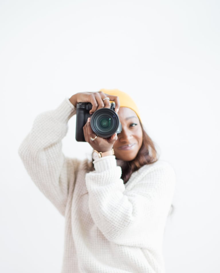Portrait of Shade holding a camera