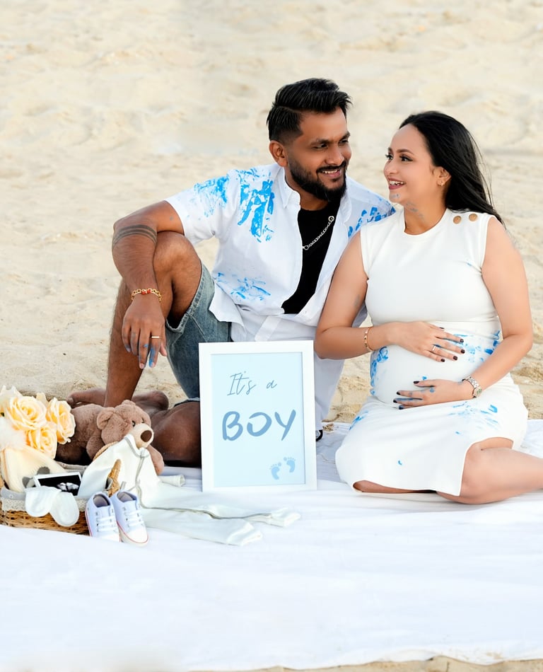 Elegant maternity photoshoot at a serene Dubai beach, capturing the beauty of motherhood.