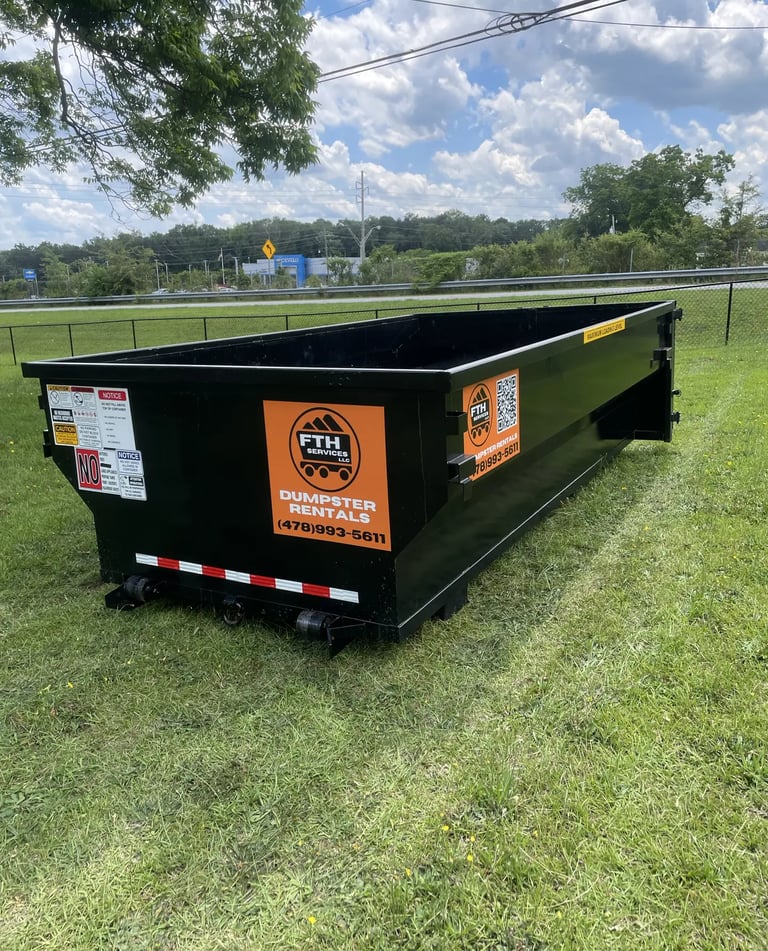 Dumpster rental in Forsyth, GA — roll-off placed in residential yard