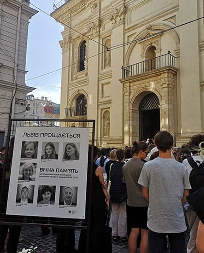 picture from the funeral of a mother and her 3 daughters