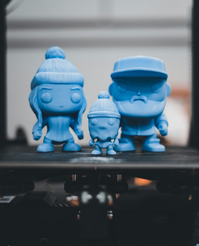 a group of blue toy figures sitting on top of a table