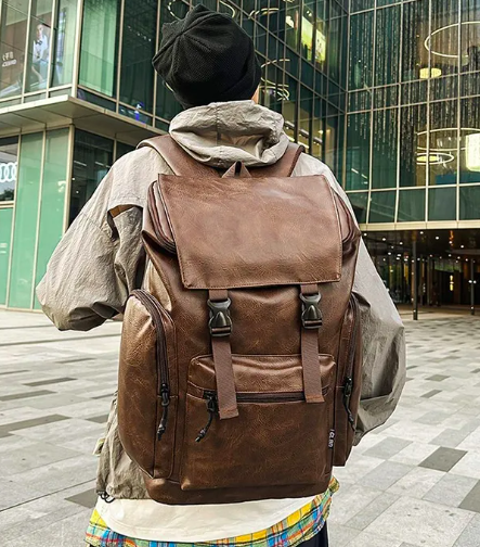 a man with a backpack on a city street