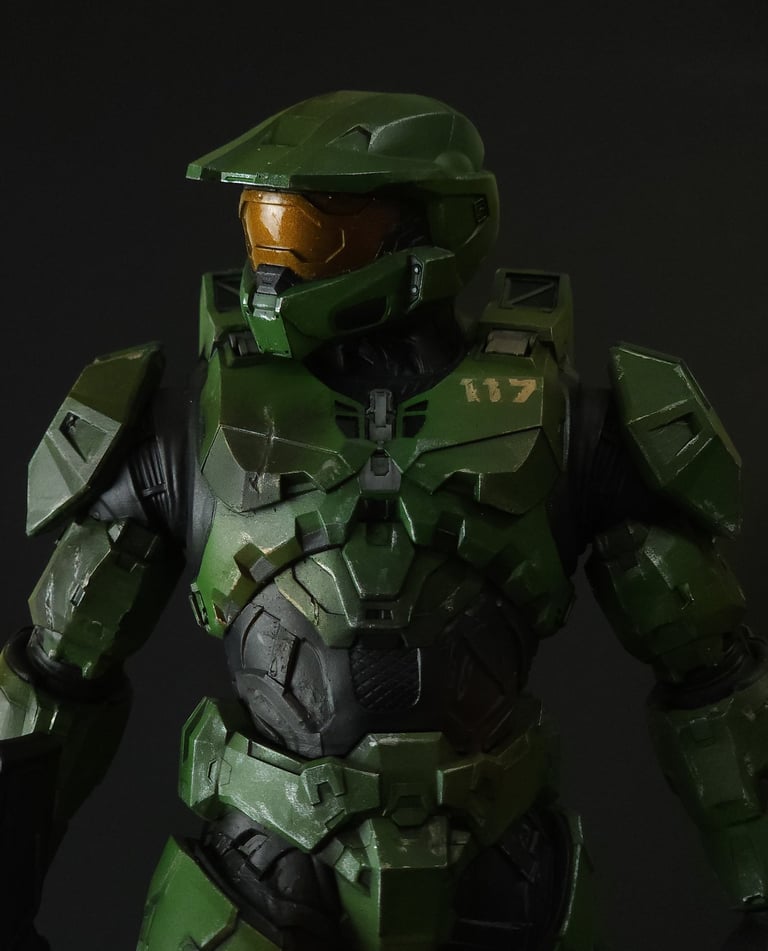 Close-up of Master Chief Spartan 117 green MJOLNIR armor 3D Print against a black background.