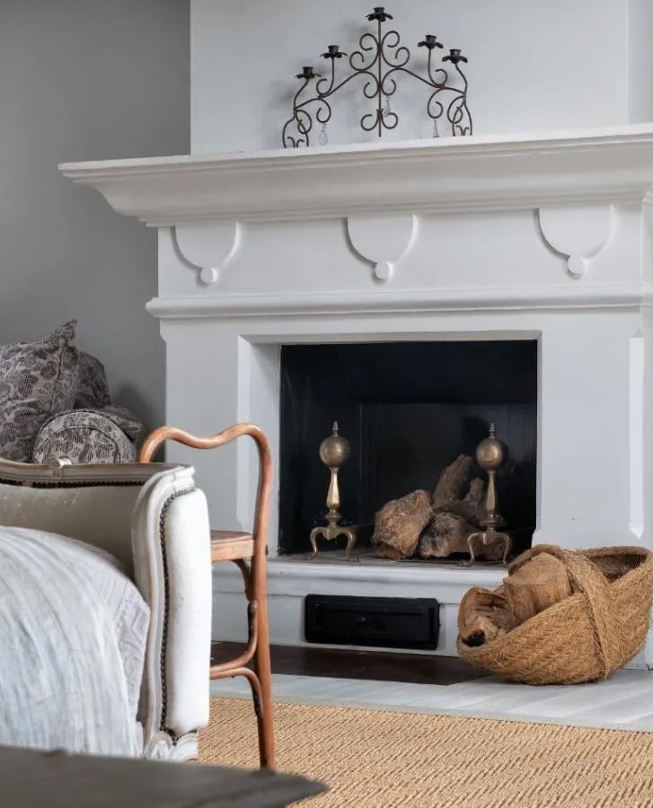 Fireplace with baskets and decor at Finca Santa Katerina