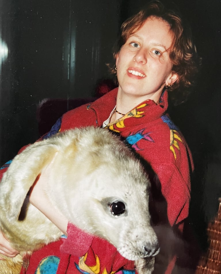 marrije verspuij holding a grey seal pup