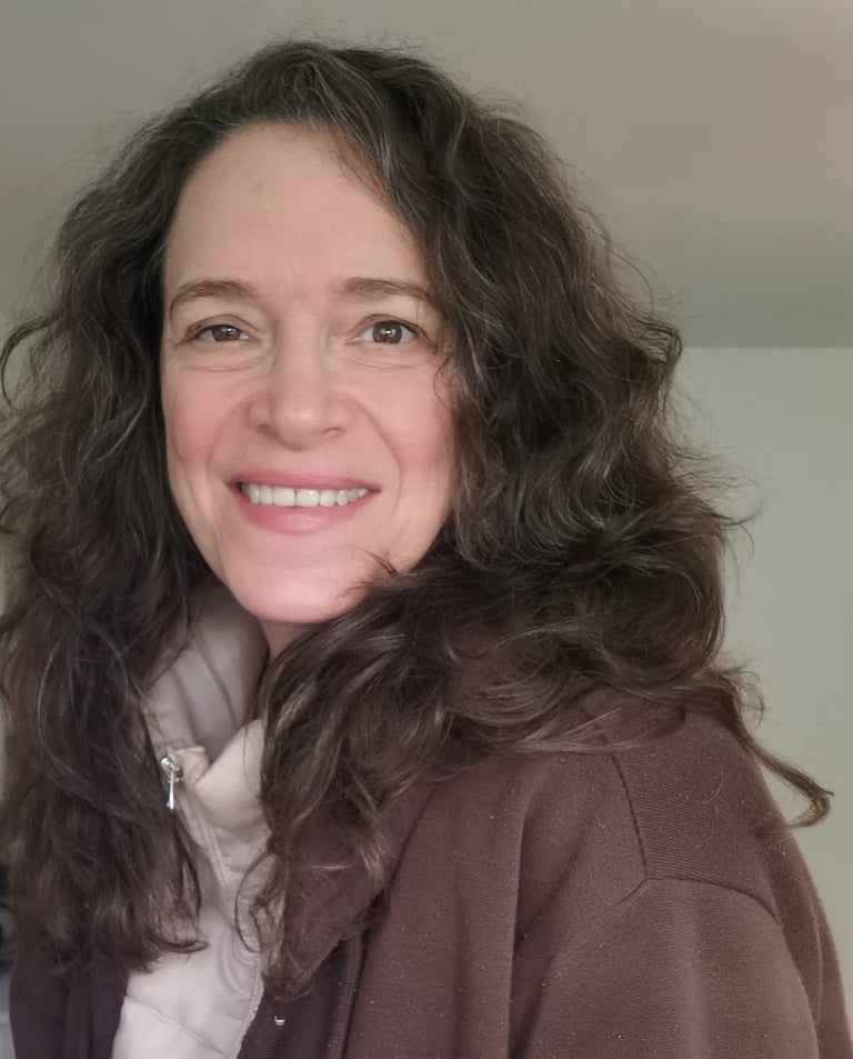 a woman with long hair and a scarf around her neck