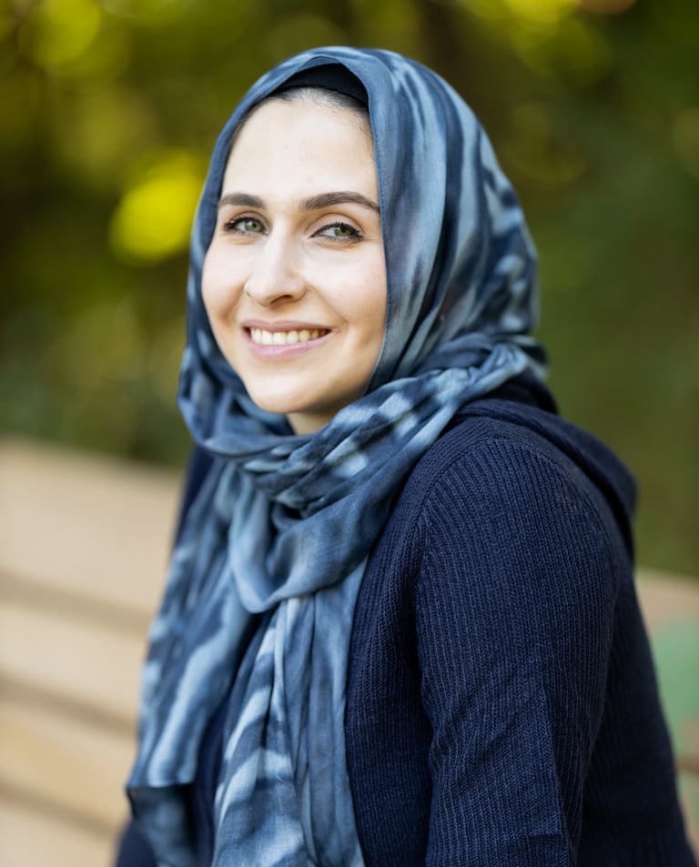 a mental health therapist in a blue scarf and scarf around her neck