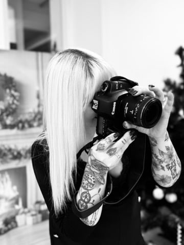 a woman taking a photo at Factory of you
