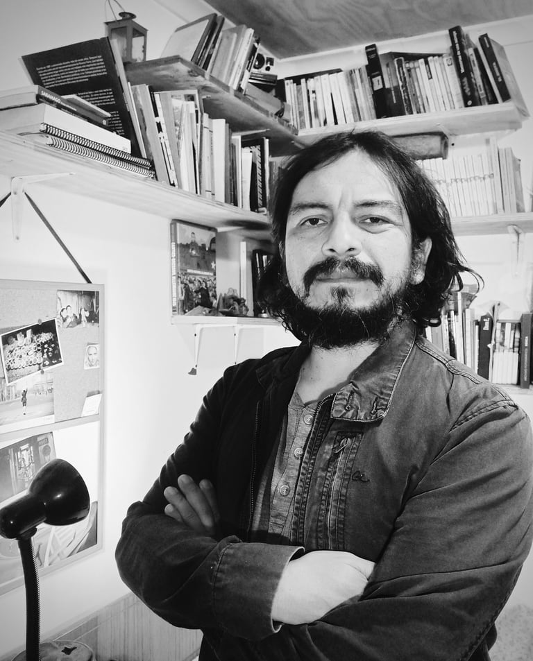 a man with a beard and a beard in a room