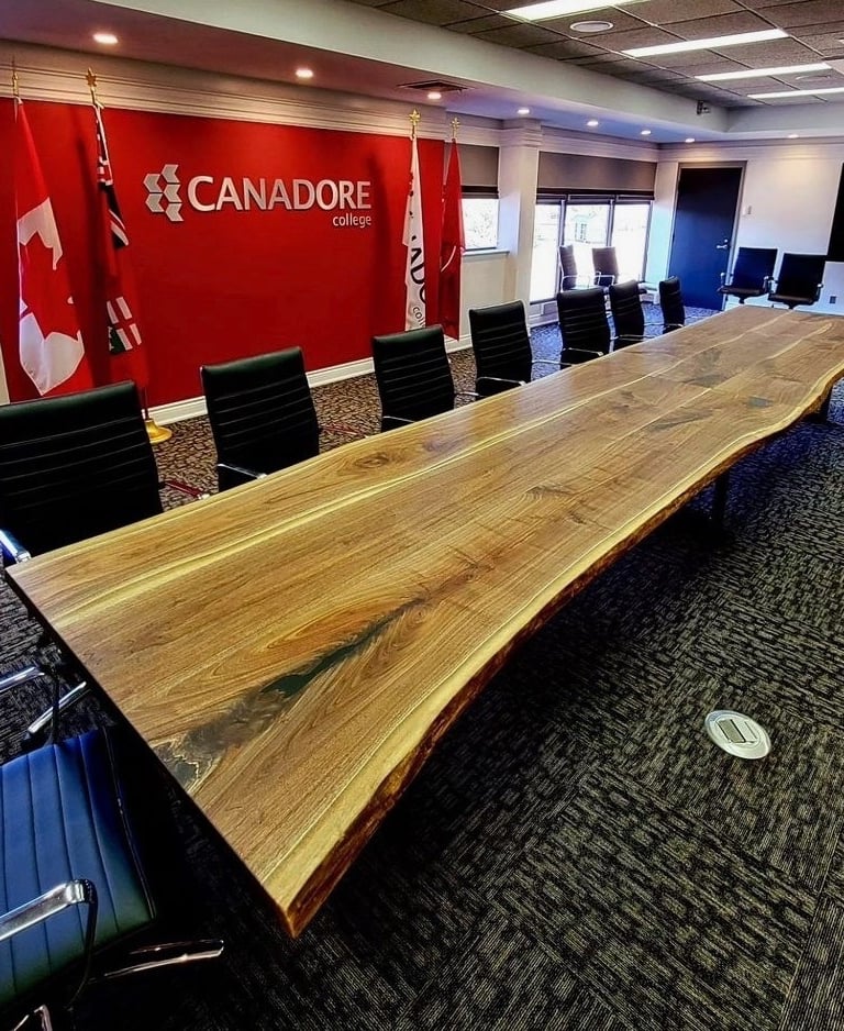 20ft x 4ft solid maple boardroom table custom built for Canadore College — installed view