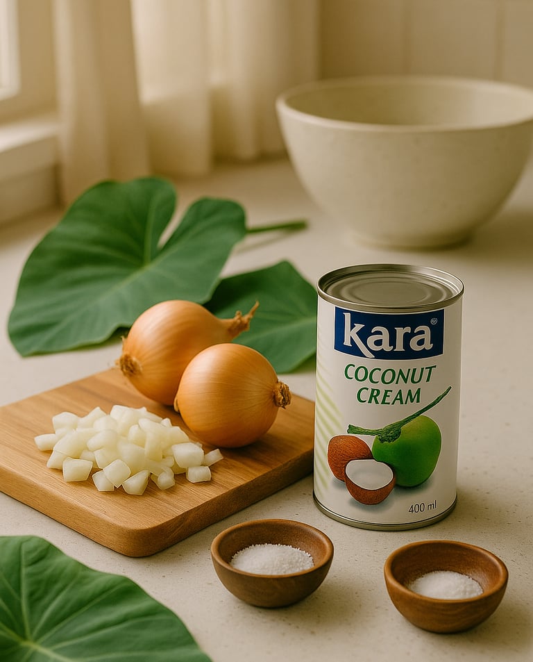 “Ingredients for Samoan Palusami (Lu‘au) including taro leaves, coconut cream, onion, and salt on a 
