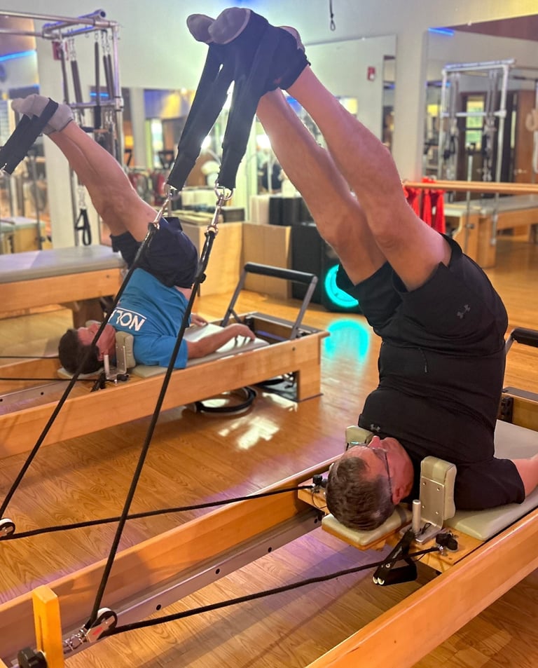 two men doing pilates