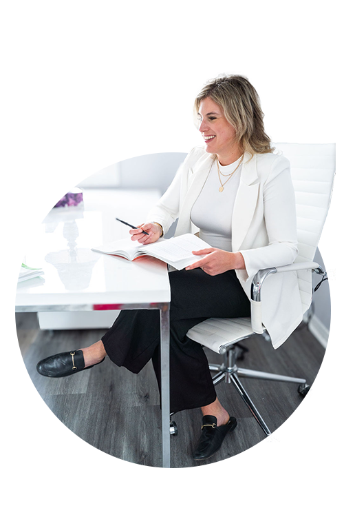 Mallory Powell, psychologist - sitting at her desk