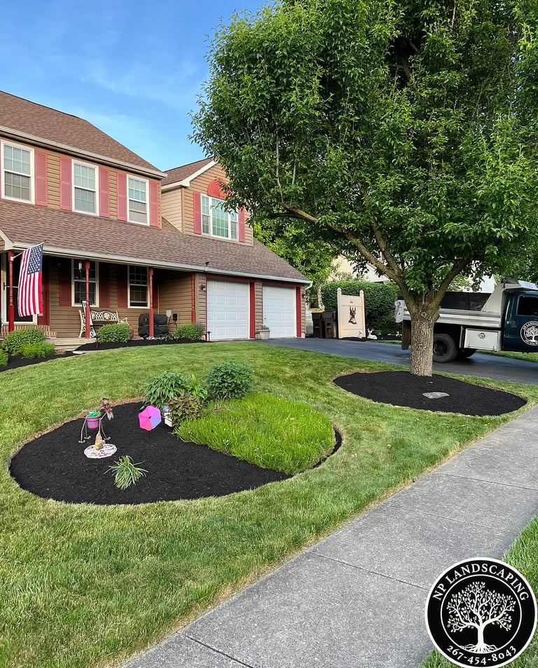 excellent landscaping and hardscaping of grass, stones and trees by NP Landscaping