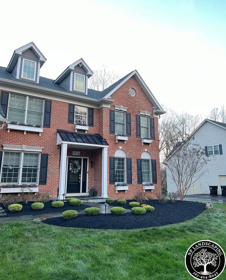 excellent landscaping and hardscaping of grass, stones and trees by NP Landscaping