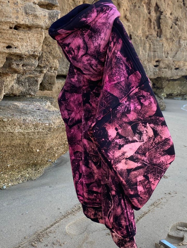 a pair of gloves hanging on a clothes line