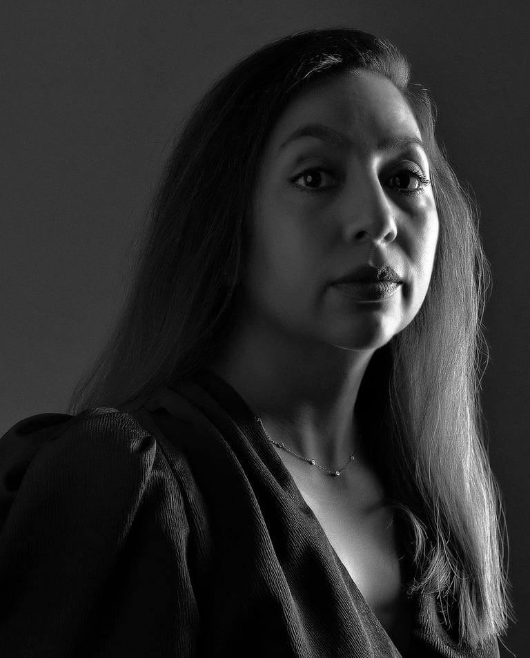 a woman with long hair and a necklace
