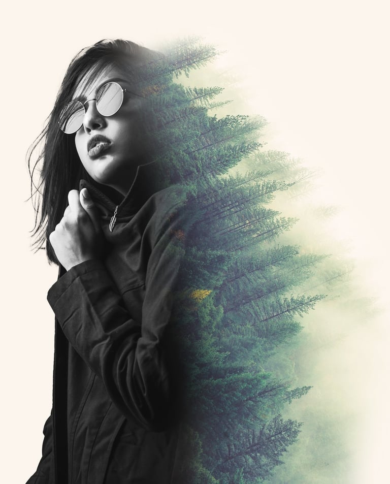 Double exposure portrait of a woman in sunglasses blended with a pine forest landscape.