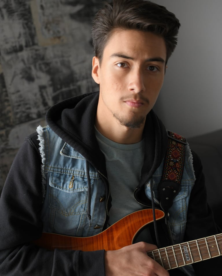 Me holding my ESP Rock Scholarship guitar.