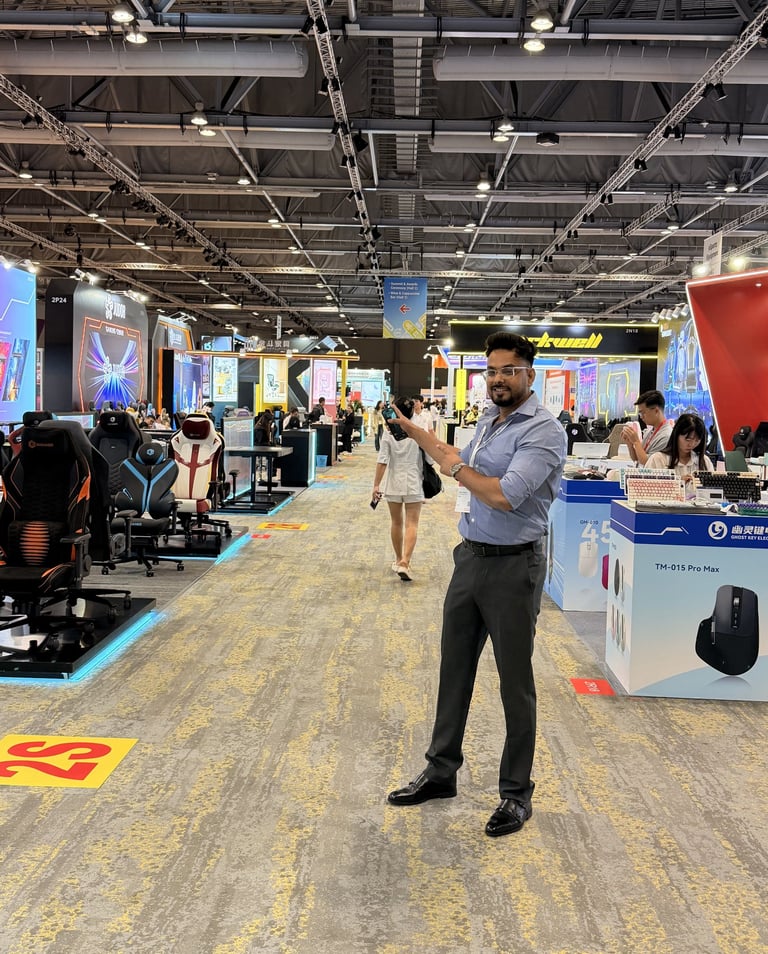 a man standing in a room with a video game controller  zoom in a bit 