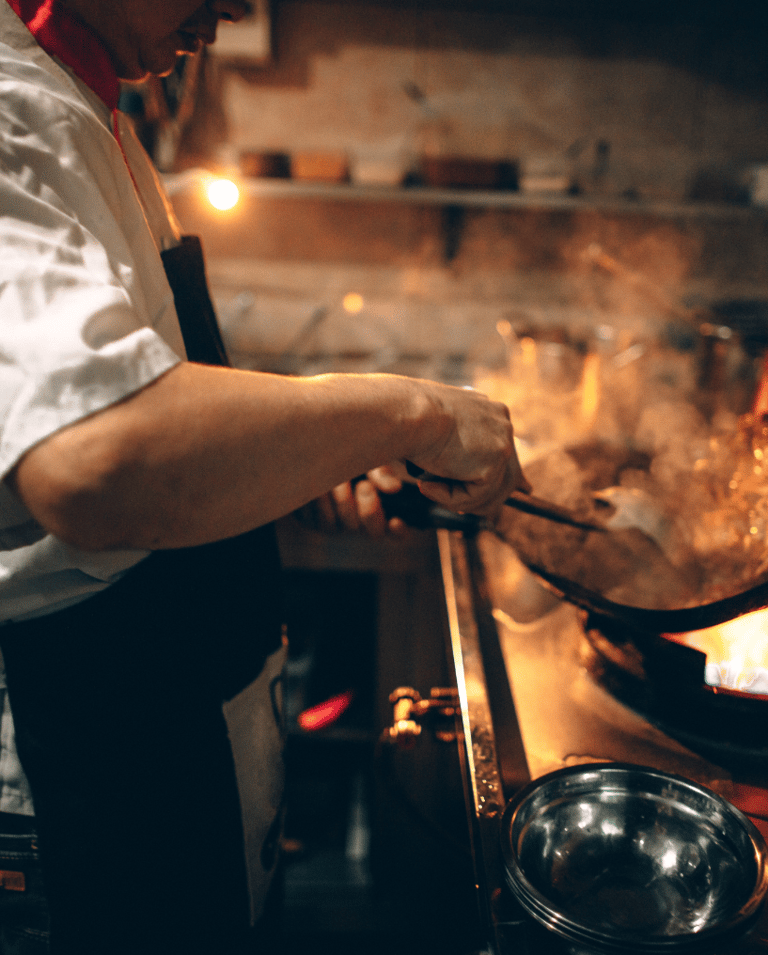 cook preparing delicious catering meals