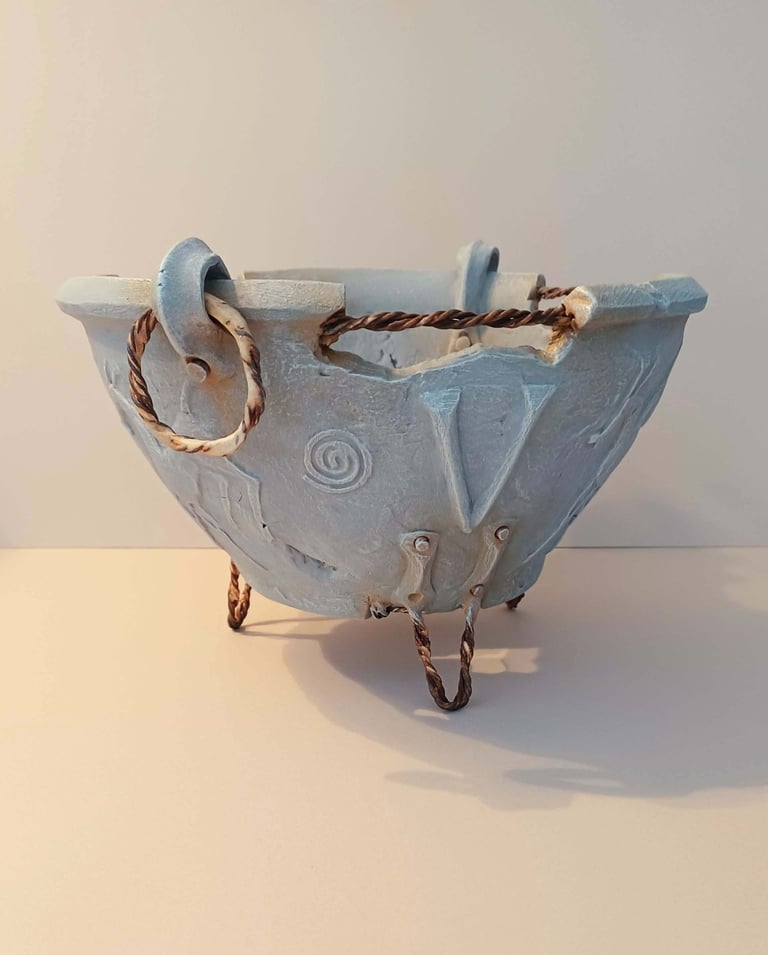 A clickable link leading to a page with information about the sculpture 'Votum'