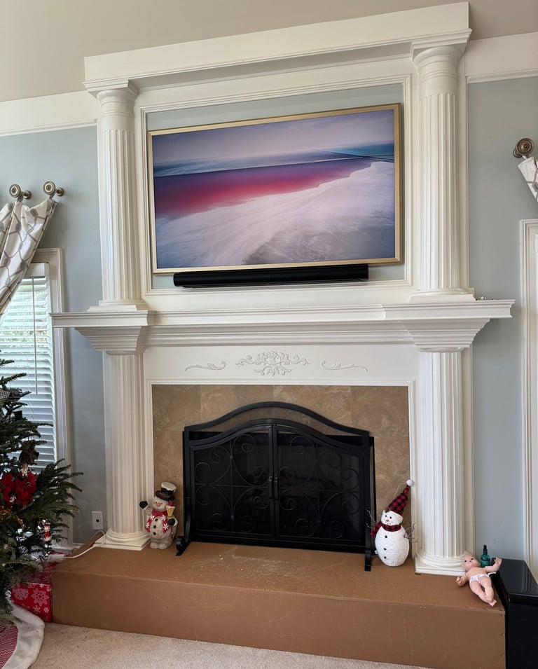Samsung the frame tv installed over a fireplace